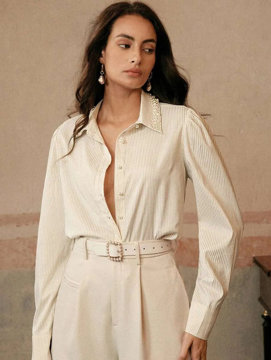 Blusa elegante y sofisticada con cuello de solapa