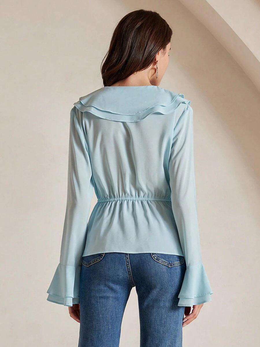 Blusa de manga larga con cuello de volantes