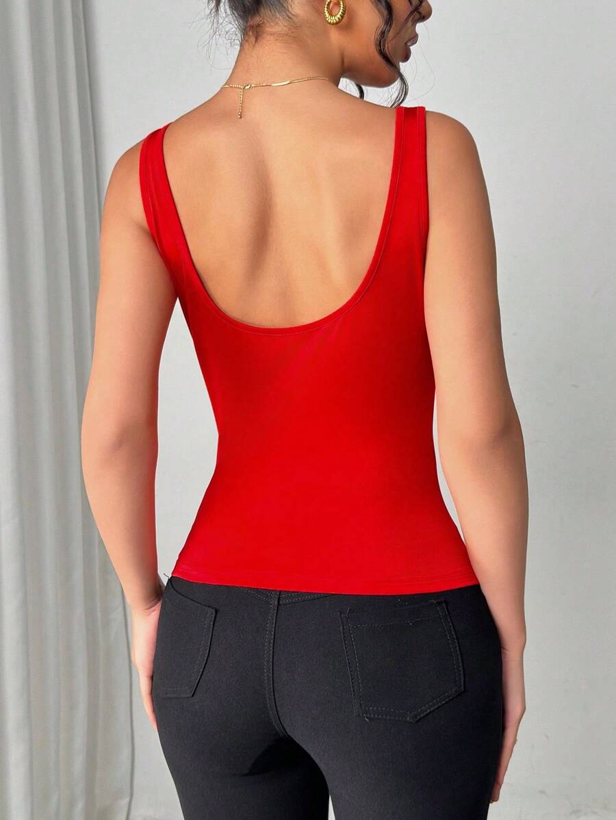Top de mujer de unicolor elegante con decoración