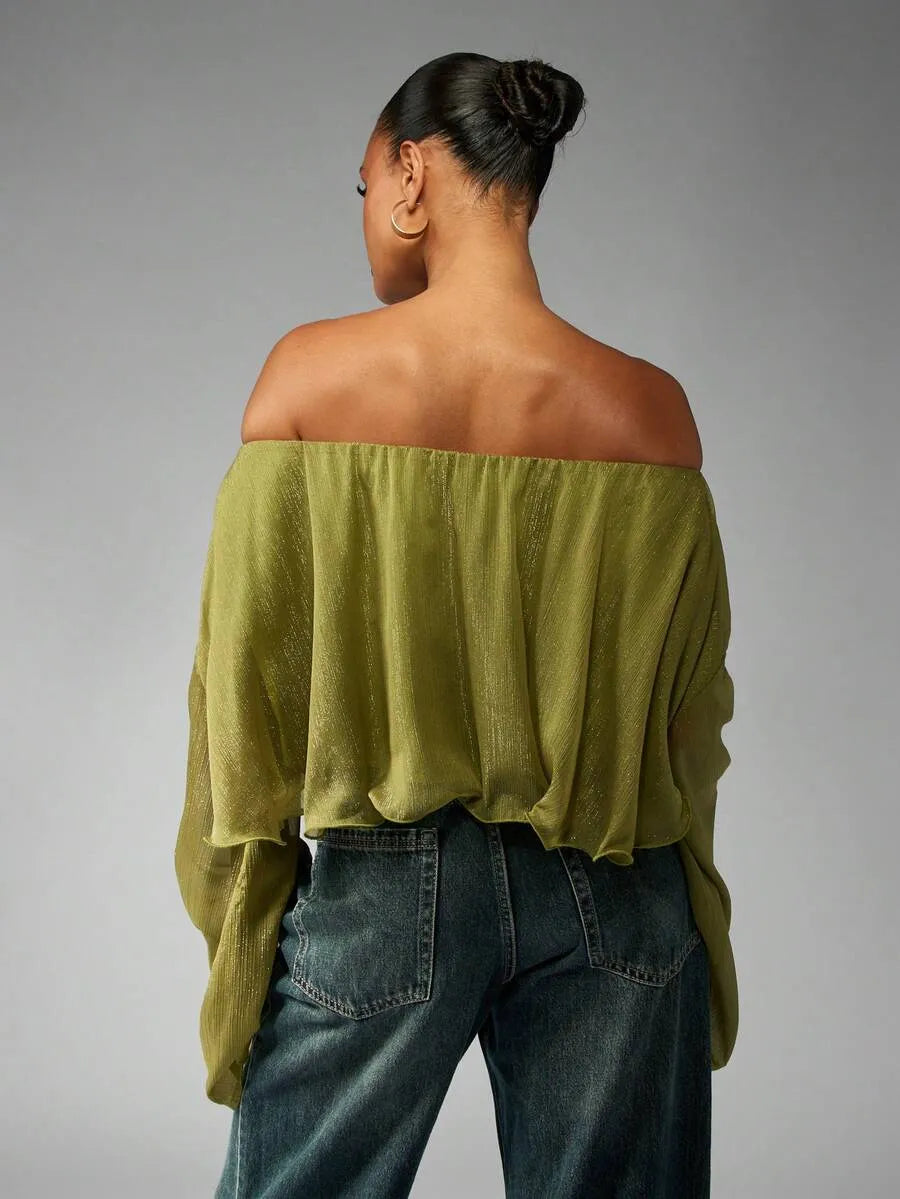 Blusa brillante de hombros descubiertos