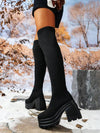 Botas por encima de la rodilla negras de moda