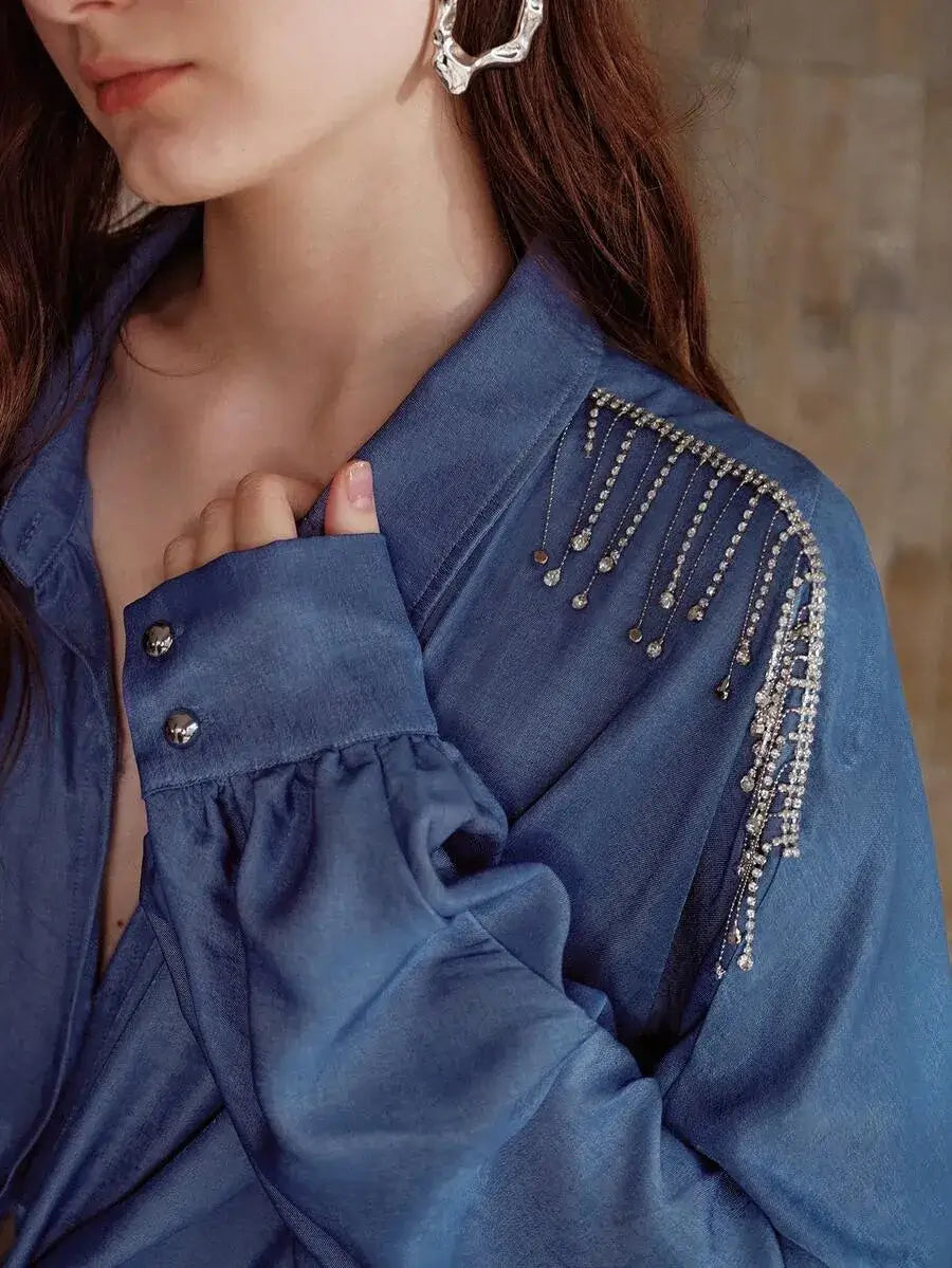 Blusa con mangas de murciélago y decoración