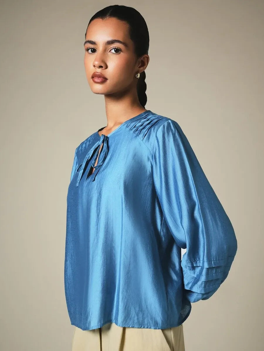 Blusa de manga larga con acabado satinado