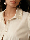 Blusa elegante y sofisticada con cuello de solapa